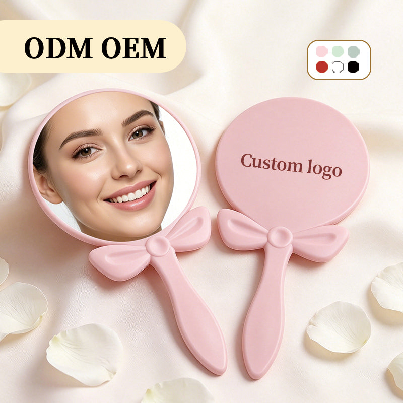 OEM/ODM Bow-knot Round Hand Mirror from Kaifam Manufacturing. Custom logo, Pantone colors, MOQ 100pcs, 15-day lead time. Request a free quote.