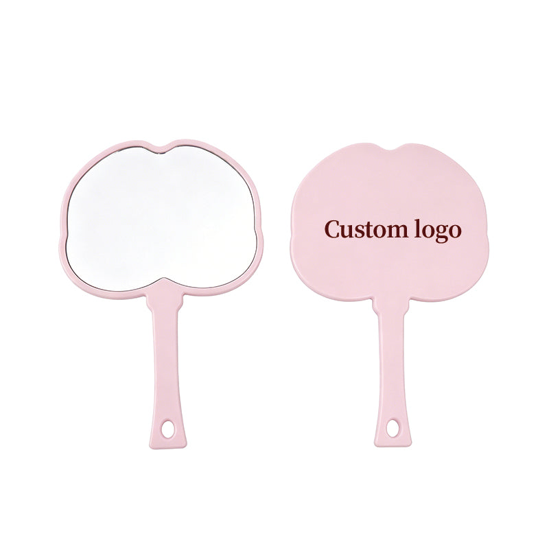 OEM/ODM Peach Shaped Hand Mirror from Kaifam Manufacturing. Custom logo, Pantone colors, MOQ 100pcs, 15-day lead time. Request a free quote.