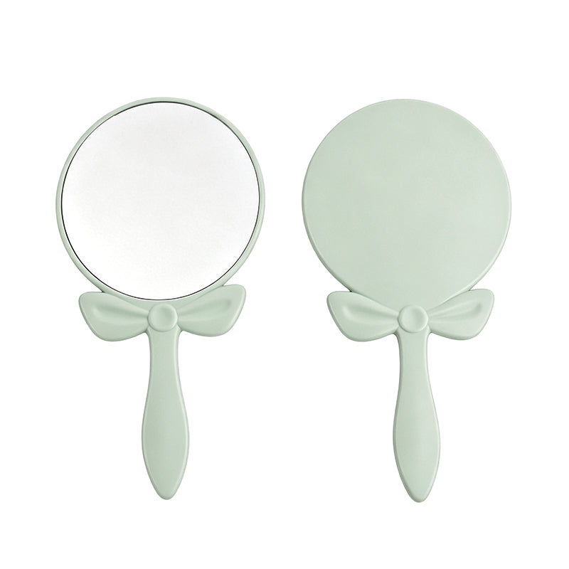 OEM/ODM Bow-knot Round Hand Mirror from Kaifam Manufacturing. Custom logo, Pantone colors, MOQ 100pcs, 15-day lead time. Request a free quote.