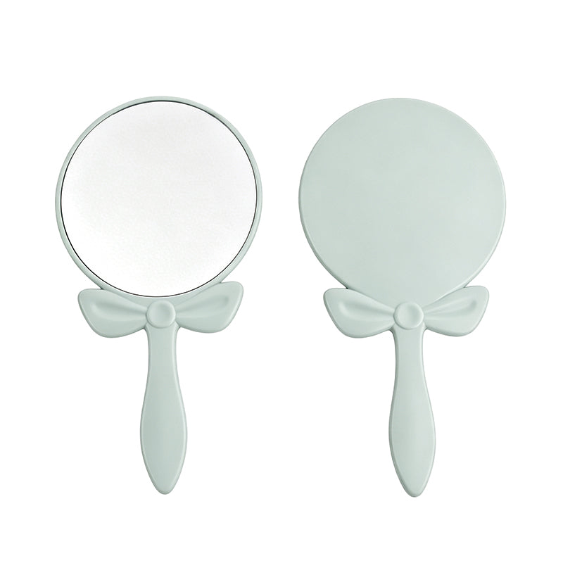 OEM/ODM Bow-knot Round Hand Mirror from Kaifam Manufacturing. Custom logo, Pantone colors, MOQ 100pcs, 15-day lead time. Request a free quote.