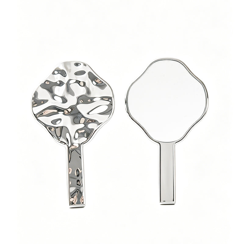 OEM/ODM Four-petaled flower with an irregular electroplated design, available as a handheld mirror from Kaifam Manufacturing. Custom logo, Pantone colors, MOQ 100pcs, 15-day lead time. Request a free quote.